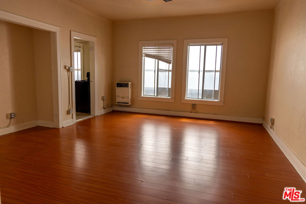 Discover urban living at its finest in this stylish 450-square-foot studio apartment at 661 Shatto Pl Unit #405, Los Angeles, CA 90005, featuring sleek hardwood laminate floors and a smartly designed 1-bath layout. Perfectly situated in the vibrant heart of Koreatown, this residence offers unparalleled access to Los Angeles' dynamic lifestyle, blending convenience, culture, and connectivity. Nestled in one of LA's most sought-after neighborhoods, you'll be surrounded by cultural landmarks, entertainment, and a thriving community, delivering an authentic urban experience. Retail therapy is just steps away with Koreatown Plaza's mix of fashion, beauty, and specialty stores, or explore unique finds at the bustling Wilshire Center, while major grocery chains like H Mart and Ralphs ensure everyday convenience. Commuting is effortless with the Wilshire/Vermont Metro Station, servicing the B and D Lines, connecting you to Downtown LA, Hollywood, and beyond in minutes, complemented by multiple bus lines along Wilshire Boulevard and Vermont Avenue and easy access to the 101 Freeway. Koreatown's food scene is a highlight, with authentic Korean BBQ at spots like Genwa or Park's BBQ, global flavors from sushi to tacos, 24-hour cafes like Sun Nong Dan, and trendy bars such as Lock & Key for vibrant nightlife. This modern studio combines compact elegance with a location that can't be beat, making it the perfect home base for professionals, students, or anyone seeking the excitement of Koreatown. Contact us today to schedule a viewing and experience the lifestyle where culture, convenience, and cuisine converge!