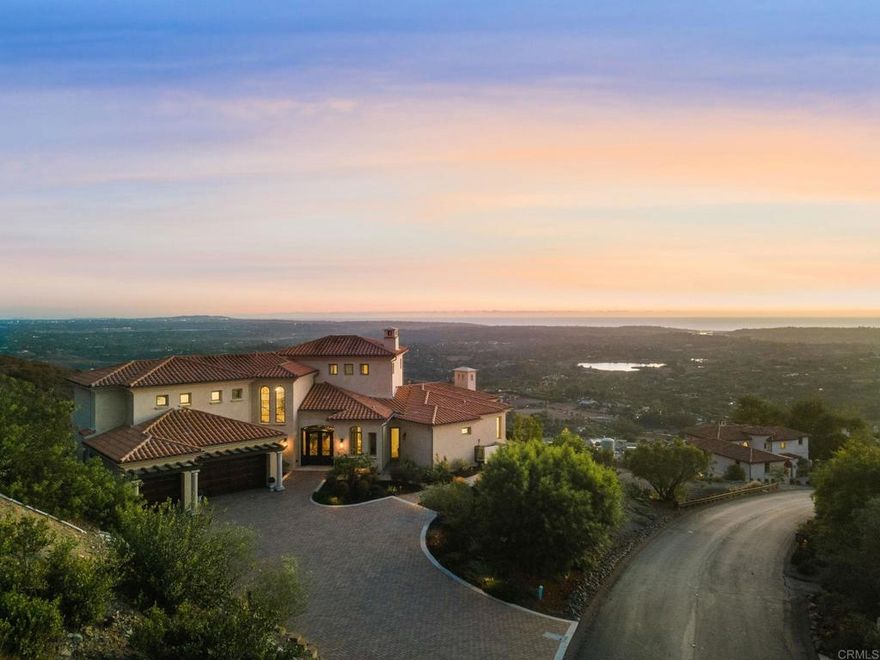 If Heaven had an address, this would be it!  A sanctuary where seemingly endless ocean views steal the spotlight with breathtaking panoramas stretching from Catalina Island to downtown San Diego. A sweeping visual masterpiece defines this extraordinary home. Perched on one of the most coveted view lots in Rancho Santa Fe’s tranquil Cielo hillsides, this one-of-a-kind custom residence is a dream come true for anyone passionate about captivating vistas and entertaining against a stunning natural backdrop. Set against classic Mediterranean architecture, the home is meticulously designed to showcase those expansive, unobstructed views from nearly every room. Completed in 2020, this energy-efficient haven features 4 bedrooms and 3.5 bathrooms within 4,115 square feet of open, luminous living space. The main-level primary suite offers dual walk-in closets and large windows framing the endless horizon. Upstairs, bedroom suites open onto a private terrace where you can soak in miles of pristine natural habitat, surrounded by serene landscapes and protected open space. The open gourmet kitchen—with a large center island and professional-grade stainless steel appliances—is perfectly positioned to keep the ocean views as the centerpiece while you cook and entertain. The great room, with soaring ceilings and abundant natural light, invites you to relax and savor the stunning scenery that fills every corner. Wine lovers will appreciate the dedicated cellar, ideal for housing your finest vintages, all enjoyed in a setting where the view remains your constant companion. Step outside to a private outdoor oasis featuring a sparkling pool, covered loggia with a fireplace, patio, and BBQ island—all designed to maximize enjoyment of the panoramic surroundings. Additional highlights include a 3-car garage, owned solar panels, a tankless water heater, and ample storage. Located within the prestigious Rancho Santa Fe community, Cielo offers access to an opulent clubhouse and abundant recreational amenities, all complemented by highly regarded schools. This is not just a home; it’s a lifestyle — where every glance out the window is a reminder of nature’s grandeur