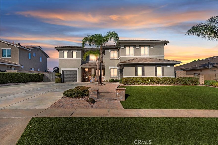 Welcome to 1641 Via Sevilla in Corona, CA — an exquisite executive residence nestled in the green hills of South Corona. Located just minutes from top-rated schools, shopping, dining, and convenient freeway access. Offering 5 bedrooms, 3 bathrooms, and approximately 3,486 sq. ft. of living space on a generous 10,454 sq. ft. lot, this home blends timeless elegance with thoughtful upgrades. From the curb, the home impresses with its easy-to-maintain landscaping featuring low-water plants and turf, an extra-large driveway, and a 3-car garage with RV parking potential. Beautiful double front doors with custom glass inlays provide a warm welcome into a bright and open floor plan. Inside, you’ll find refined details including wainscoting, wood shutters throughout, and an abundance of natural light. The spacious living and dining rooms flow seamlessly into the family room, enhanced with a custom surround-sound system for an immersive experience. The kitchen is truly the heart of the home, showcasing a large center island, granite countertops, a walk-in pantry, and newer appliances (dishwasher just one year old, microwave two years old). A central vacuum system adds modern convenience, while the upstairs offers generously sized bedrooms along with a large bonus room—perfect as a game room, home office, or media space. The backyard retreat is designed for both relaxation and entertaining. Enjoy the shade of the Alumawood patio cover, gather around the firepit, or host barbecues at the built-in outdoor kitchen. The sparkling rock pool and spa have been refreshed with cleaned tile and repainted rock features, while the pool heater and pump were recently replaced for worry-free enjoyment. Additional highlights include paver hardscaping, a dog run on the side yard, and easy-access outlets for Christmas lights conveniently controlled from inside the home. Practical upgrades such as two HVAC systems, a Brinks alarm system with cameras, and recently replaced garage doors and exterior paint (completed one year ago) add both comfort and peace of mind. With its combination of resort-style amenities, energy-conscious landscaping, and premium location nestled in the hills, 1641 Via Sevilla offers the ultimate Southern California lifestyle.
