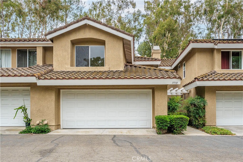 Step into comfort and style in this beautifully updated 2-story condo in West Covina with 2 primary bedrooms! With soaring high ceilings and an open floor plan, this home offers a bright and inviting space perfect for both relaxing and entertaining. The spacious living room features a cozy fireplace and flows seamlessly into the dining area and kitchen, making gatherings easy and enjoyable. Upstairs, you’ll find two generously sized primary bedrooms, each with its own private bathroom ideal for privacy or guests. A convenient half bathroom is located downstairs for added ease. Fresh interior paint, brand-new carpet, and stylish new recessed lighting give the home a fresh, modern feel. Step outside onto your Trex deck, perfect for morning coffee or evening unwinding. Enjoy the convenience of a 2-car attached garage with direct access and take advantage of the community pool and spa for those sunny California days. Located near shopping, schools, parks, and dining, this home offers the lifestyle you’ve been looking for. Don’t miss your chance make this charming condo your home!