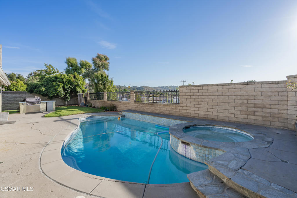 This charming 4-bedroom, 2-bath single-story home with a view in Moorpark has been beautifully updated with fresh paint throughout. The spacious backyard features a sparkling pool with a premium gas-heater and energy-efficient variable-speed pump, plus a built-in BBQ with a mini fridge for outdoor entertaining.The home has solar panels with a 225 AMP service panel, upgraded inverter, and solar panels (replaced in 2018, with room to double capacity). The entire AC system and gas furnace were professionally replaced around 2020 for optimal comfort. Milgard windows throughout enhance the home's overall efficiency. The front yard boasts low-maintenance, CA-native plants with drip irrigation, while the North yard includes mature fruit trees (lemon, lime, grapefruit, and mandarin). The South yard features sod and an intelligent sprinkler system.Additional features include security cameras, a pool-compliant fenced back slope, and the ability to extend the fence by 12 feet. Don't miss this eco-friendly home with a pool and outdoor space--schedule your tour today!