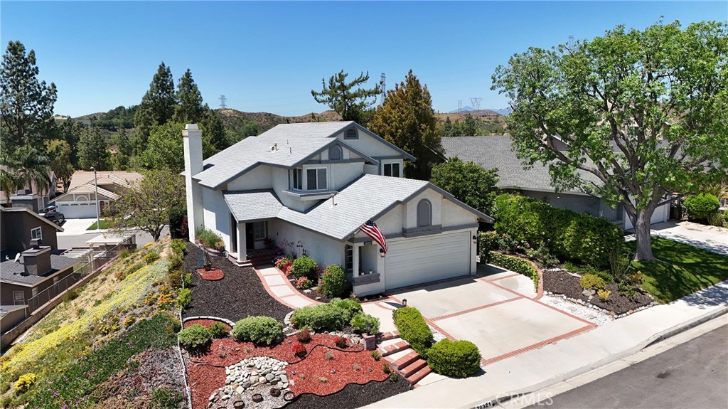 Welcome to your next home, gracefully set above the street for enhanced privacy and unbeatable curb appeal. This 3-bedroom, 3-bathroom gem offers 1,592 sq ft of thoughtfully designed living space in one of Santa Clarita’s most desirable neighborhoods.
Step inside to discover a bright, open-concept layout that effortlessly blends comfort and functionality. The inviting living room, complete with a cozy fireplace, flows seamlessly into the dining area—ideal for entertaining or relaxing evenings at home.
The kitchen is sure to impress with sleek countertops, modern cabinetry, and a layout that’s perfect for everything from quick breakfasts to gourmet dinners.
Enjoy California living at its best with easy access to local parks, top-rated schools, and plenty of shopping and dining options nearby—all while being part of a peaceful, great community. NO HOA!
This move-in-ready home is the perfect blend of style, comfort, and location. Don’t wait—come see it today!