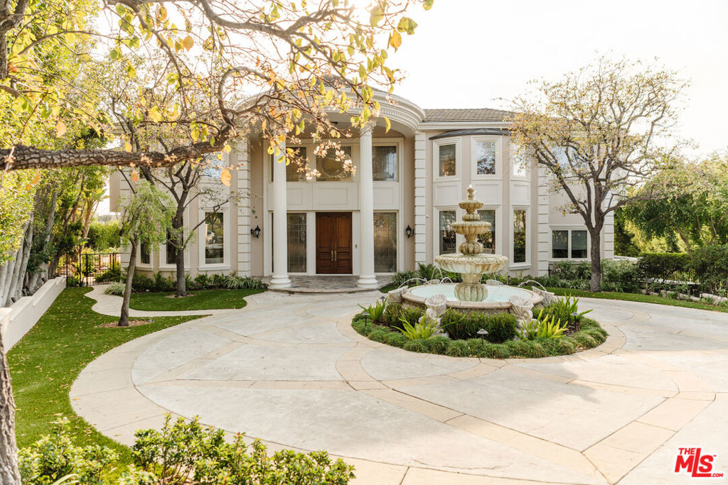 Nestled at the end of a private cul-de-sac behind the prestigious guard gates of Bel Air Crest, this meticulously designed and luxurious 7-bedroom, 10-bathroom estate sits on a rare double lot with breathtaking views. This exceptional property offers an unparalleled living experience with an extraordinary floorplan that includes a grand entry, a spacious gourmet kitchen, a family room, an enormous primary suite, and newly added state-of-the-art amenities. The home features a cutting-edge all-digital Steinway Lyngdorf home theater, a Full Swing Golf Studio complete with a Top Golf Suite in the guest house, and a ceramic studio equipped with a premium Skutt kiln. Multiple offices and a stunning billiards/game room further elevate the home's functionality and entertainment options. An elevator seamlessly connects all levels, adding convenience and accessibility. Upon entering, you'll be greeted by a serene ambiance and a striking water feature that flows gracefully through the home, creating a tranquil environment. The property is set back from the street behind its own private gates, offering a large motor court and a garage with space for approximately six+ cars. Every detail of this home has been thoughtfully updated, sparing no expense. Highlights include custom hardwood oak floors, beautifully remodeled bathrooms, and ember-protected vents by Brandguard Vents. The exterior is equally impressive, boasting a rose garden, a saltwater pool, a gazebo, and multiple terraces that overlook the sprawling 1-acre site. A premium putting green, designed by Back Nine Greens, completes the outdoor space, offering the ultimate luxury for golf enthusiasts. This rare gem combines the epitome in luxury and functionality with the added security and privacy of a guard-gated community. A unique opportunity to call one of Bel Air Crest's finest homes your own.