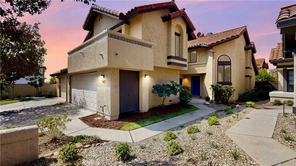 Nestled within the coveted Griswold’s gated community, this impeccably maintained residence showcases the largest floor plan offered and has been thoughtfully enhanced with fresh interior paint, new lighting throughout, a brand-new electrical panel, and beautifully updated second-level bathrooms. A grand living room flows seamlessly into the spacious family room with soaring vaulted ceilings, while a separate formal dining area with a built-in bar sets the stage for elegant entertaining. The fully remodeled gourmet kitchen is a culinary masterpiece, featuring quartz countertops, designer-coordinated backsplash, custom cabinetry with decorative glass inserts, a deep undermount sink, and top-of-the-line stainless steel appliances including a Viking Professional Range with Xtreme Air hood, Bosch dishwasher, dual-control wine refrigerator, and a Miele built-in coffee system. Recessed can lighting enhances the kitchen’s sophisticated ambiance. Double-pane Milgard windows and sliding doors frame serene views and fill the home with natural light. An indoor laundry room adds everyday convenience, while the elegant primary suite boasts a spa-inspired bathroom. Upstairs, a versatile loft offers the perfect space for a home office, fitness studio, library, or potential additional bedroom. A generous balcony shared by the second and third bedrooms provides a peaceful retreat with picturesque foothill views. The two-car attached garage features durable metal shelving for organized storage. Designed for effortless entertaining, the open-concept layout flows to a low-maintenance backyard with four fruit trees—lemon, tangerine, apple, and pomegranate—creating a tranquil indoor-outdoor lifestyle. Enjoy the community’s resort-quality grounds, sparkling pool, and two spas, all just moments from excellent Claremont School District and the California Botanic Garden. Stroll to the charming Claremont Village and renowned Claremont Colleges from this rare and exquisite home. Take advantage of all that Claremont has to offer with its expansive hiking trails.