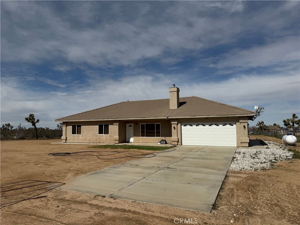 Photo of 8720 Greasewood Lane, Victorville, CA 92392 (MLS # HD26038330)