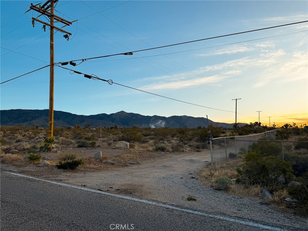 Situated along the paved stretch of Crystal Creek Rd in the heart of Lucerne Valley, this 5-acre parcel offers a prime opportunity for homebuilders or anyone dreaming of wide-open living with essential utilities close at hand. With electric and phone poles already on the road, and direct access from a paved street, much of the heavy lifting is already done—just bring your plans for a well and septic system. The lot’s generous size provides ample space for a custom home, workshop, animals, or even a desert retreat. Enjoy the tranquility of San Bernardino County's high desert while still being within reach of local amenities and highways. APN: 0450-311-16-0000. GPS: 34.39798, -116.94718.