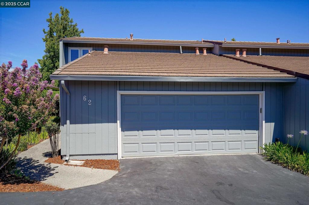 There is a reason why this neighborhood is called Rolling Green. The attractive grounds meander through the subdivision creating a tranquil ambience. There is also a sparkling pool for residents to enjoy and a club house. This home has been extensively updated with new luxury vinyl plank flooring on the main level & plush carpet on the upper level. The living rm has high ceilings and an attractive fireplace with a gas starter. The dining area has a skylight adding natural light. The kitchen has new appliances, new granite counters, faucet, lighting and freshly painted cabinetry. Don't miss the large storage area under the staircase, making a perfect pantry. There is a bedroom and updated bath on the main level, great for guests or an office. The primary bathroom has a new shower, vanity, lighting & flooring. The second bedroom in this floor plan is also very spacious. Other updates include new closet doors, new vanity in lower bathroom, new high-rise toilets and lighting. Private patio with no rear neighbors and 2 car garage with storage shelves & laundry area - washer and dryer included. Close to shops, restaurants and the canal trail path makes this an ideal location.