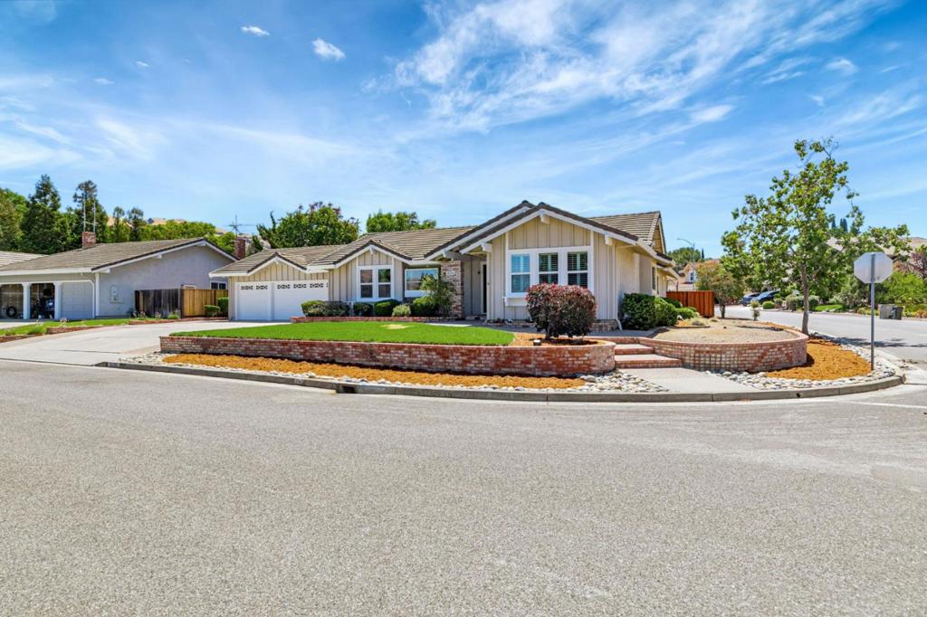 Welcome to this beautifully updated single-story home nestled in one of San Jose's most sought-after neighborhoods in Evergreen. Boasting 4 spacious bedrooms, 2 full bathrooms & an impressive 2,242 sq ft of open-concept living space, this residence offers both luxury and comfort on a rare 16,000 sq ft corner lot. Step inside and be captivated by the vaulted ceilings, recessed lighting, and premium LVP flooring that flows seamlessly throughout. The heart of the home is the remodeled gourmet kitchen, featuring high-end appliances, an oversized quartz island, farmhouse sink, and a bar area with built-in wine refrigerator, perfect for entertaining! Enjoy year-round comfort with central heating & A/C, and fresh appeal with new int & ext paint. The 3-car garage adds practicality, while the park-like backyard offers endless possibilities with new fencing, a basketball court, lush fruit & shade trees, and a brand new front sod lawn. The generous lot is ideal for outdoor entertaining or a potential pool or ADU addition. Located in a quiet, family-friendly neighborhood, this home is close to award-winning schools, scenic walking trails, beautiful parks, top-tier golf courses, and premium shopping. Don't miss your chance to own this Evergreen oasis, luxury, space, and lifestyle all in one!
