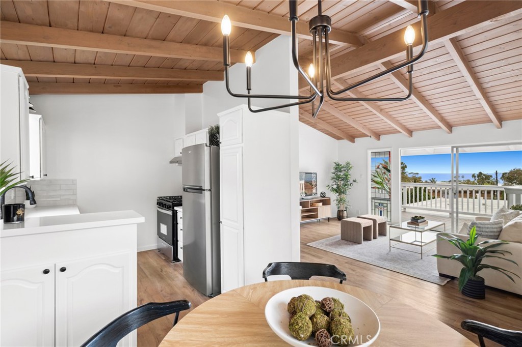 This is your opportunity to own a versatile ocean-view property in the heart of Laguna Beach Village—ideal for the savvy investor or a buyer seeking the perfect blend of lifestyle and long-term value.
Perched above Main Beach, this unique property captures sweeping views of the Pacific Ocean and twinkling city lights, offering an exceptional coastal living experience. The highly walkable location is just moments from Main Beach, acclaimed restaurants, the vibrant farmers market, and Laguna’s renowned summer art festivals—making it a dream setting for full-time living, vacationing, or hosting guests.
The front residence features two bedrooms, one bath, and an inviting ocean-view deck. One of the bedrooms directly overlooks the sparkling Pacific, creating a tranquil retreat for residents or renters alike.
The rear home, Residence 137, offers two upstairs bedrooms (one with ocean views), a full bath, and a large deck perfect for entertaining or enjoying coastal sunsets. A flexible lower-level space with a full bath offers potential for a generous primary suite, additional living area, or even a guest suite—ideal for multigenerational living or as a premium rental unit.
Each unit includes its own private 2 car garage, plus there are four additional parking spaces—an exceptional amenity in this sought-after neighborhood. On-site laundry adds convenience for both owners and tenants.
Whether you’re searching for a high-yield investment, a multi-generational home, or a personal coastal escape with income potential, this property delivers. With panoramic ocean views, walk-to-everything convenience, and flexible living spaces, this is a rare chance to own a piece of paradise in one of Southern California's most iconic beach towns.
Don't miss this exceptional Laguna Beach offering—where lifestyle and investment come together.