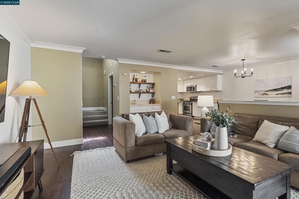 Welcome to 321 Via Cordova Lane, a beautifully updated townhome in the highly sought-after Mission Pines community. Designed for both comfort and style, this home offers light-filled living spaces, a cozy gas fireplace, and sliding doors that open to a private patio perfect for morning coffee or evening entertaining. The updated kitchen features a gas range, pantry, and plenty of storage, flowing seamlessly into the dining area. A full bath on the main level adds everyday convenience. Upstairs, the oversized primary suite includes a private balcony and ensuite bath, complemented by a spacious second bedroom, hall bath, and upstairs laundry. Additional highlights include a newer central HVAC system, spacious 2-car garage, and access to Mission Pines’ resort-style amenities: pool, tennis courts, and clubhouse. All just minutes from top-rated schools, shopping, parks, trails, BART, and vibrant downtown Martinez. Even better; we have a VA assumable loan at approximately 2.25% (subject to VA/lender approval) offers a rare chance to potentially secure below-market financing and NO rental restrictions!