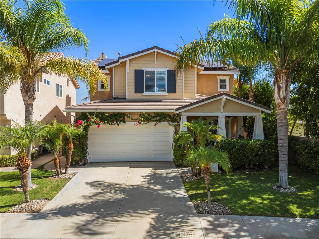 PANORAMIC VIEWS + OWNED SOLAR IN THIS GORGEOUS ALTA VISTA HOME! Welcome to this beautifully upgraded 4-bedroom, 2.5-bath POOL home, perfectly positioned on a premium lot with no rear neighbors, sweeping views of Santa Clarita PLUS perfect views of 4th of July fireworks! This beautifully maintained home offers incredible curb appeal with lush landscaping, nearly 20 palm trees, a cozy covered front porch, plus a spacious backyard designed for entertaining! Inside, you’ll find a bright, flowing layout with recessed lighting, plantation shutters, and tasteful finishes throughout. The upgraded kitchen boasts white cabinetry, granite countertops, a center island, stainless steel appliances including a double oven and beverage cooler, plus backyard views and a walk-in pantry. The adjacent family room is spacious with a cozy fireplace and custom built-ins. A main floor versatile office with built-in cabinetry offers functionality for work or study. Upstairs, the primary suite offers scenic views plus an ensuite bath with dual sinks, soaking tub, and separate shower. Two additional bedrooms share a full bath with double vanities, and a convenient upstairs laundry room completes the layout. Step outside to your own resort-style backyard featuring a sparkling saltwater pool with waterfall feature, relaxing spa, fire pit, and a covered patio with ceiling fan creating the perfect setting to enjoy peaceful evenings and incredible views! New air conditioner and water heater both installed in 2024! With OWNED solar, no rear neighbors, a 2-car garage, and NO Mello-Roos, this is a rare opportunity to enjoy privacy, comfort, and the very best of Santa Clarita living!