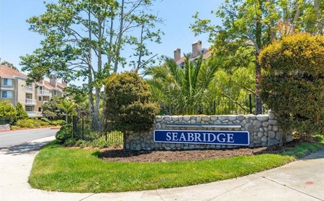 Located in the Seabridge Villas community, this two-bedroom, two-bath condo offers privacy, space, and serene views of lush landscaping, tranquil waterfalls, and peaceful ponds. Inside, you’ll find a spacious kitchen with ample counter space, a breakfast bar, and an open flow into the living area, perfect for entertaining or relaxing. The living room features a cozy fireplace and large sliding glass doors that lead to a private balcony overlooking the tropical grounds. This floor plan offers dual primary suites on opposite sides of the home. The front bedroom includes direct access to a full bath that also serves as a guest bathroom. The rear primary suite features an on-suite bathroom and its own sliding door to the balcony. Each bedroom includes two closets, with the front bedroom offering a large walk-in. Additional features include in-unit laundry with a stackable washer and dryer, a storage closet on the balcony, and two assigned covered parking spaces conveniently located near the elevator. Seabridge Villas is a 24-hour guard-gated community offering resort-style amenities including two pools and spas, four tennis courts, a fitness center, sauna, and clubhouse. All just minutes from Pacific City, Downtown Huntington Beach, and the Huntington Beach Pier.