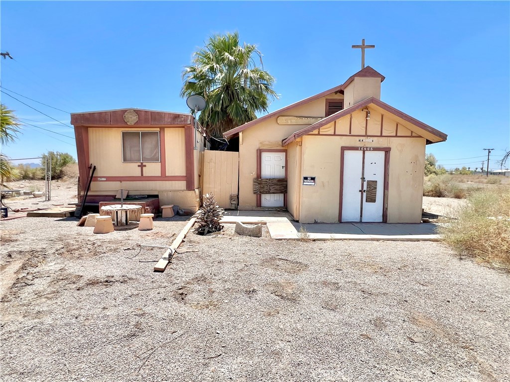• INVESTOR / HANDYMAN SPECIAL! • Freestanding Residential + Commercial Corner Property - Great Potential & Quick Access to I-10! Take Advantage of this Unique Opportunity: ±940 Sq Ft Former Church Building, and ±460 Sq Ft Single Wide Manufactured / Mobile Home! Building has spacious open floor plan with High Ceilings! Utilities Were Previously On! Situated on large 13,068 Sq Ft / 0.30 Acre Parcel! Located Among Established Homes, adjacent neighbor at 24100 San Juan Ave! Transform This Versatile Commercial / Residential Space into a Profitable Short-Term Rental, Office, or Retail Opportunity! Buyer to Verify All Possible Uses. Perfect for Owner-User to Live/Work! Sold As-Is. Also Listed as Commercial Listing MLS: OC25179665