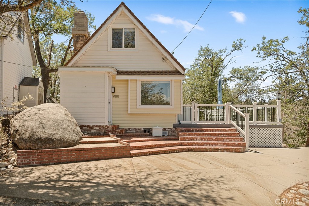Nestled amidst the trees and boulders, in a peaceful mountain setting, this updated, charming mountain retreat delivers comfort, privacy and an inviting space. You will be captured by the light and bright feel and can really feel the pride of ownership as soon as you arrive. It offers 1 bedroom with a loft/space perfect for extra sleeping space. There is an updated kitchen with granite counter tops and is open to the living room. The electric fireplace in the living room creates a warm and cozy atmosphere. Unwind or entertain on your oversized, private side deck with picturesque views or on your back patio area overlooking the trees. This cabin is not just a home, it's a lifestyle and comes Turn-Key, furnished, minus sellers personals. There are dual-pane windows and vinyl siding to help with energy efficient living. There is a large concrete buildup space great for storage and also has laundry hook ups with hot and cold water connections, all that's left to complete is the dryer hookups. This is a prime location for commuters, close to Hwy 18 and the Lake Arrowhead Village. Seize this opportunity to own your slice of mountain paradise, where everyday feels like a vacation.