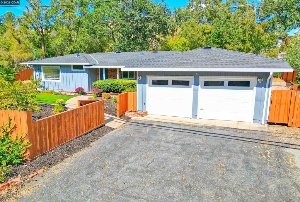 Welcome to a rare find in Concord: a beautifully updated 3-bedroom, 2-bath home on a massive 21,780 sq. ft. lot. This is a property that offers the perfect blend of modern living and incredible outdoor potential. Step inside and you'll find a bright, open layout with classic hardwood flooring and an updated kitchen that is truly the heart of the home. It features gorgeous quartz countertops and sleek stainless steel appliances, making it a perfect space for everyday meals or entertaining friends. Enjoy the comfort of modern essentials like dual-pane windows and central heat & A/C throughout. The real showstopper is the incredible outdoor space. The huge 1/4acre fenced side yard is a blank canvas for your dreams—imagine a sparkling pool, a future ADU, or finally having a dedicated spot for your RV or boat! The expansive backyard provides even more room for outdoor fun and expansion. This home also includes an updated laundry room and a two-car garage with plenty of extra driveway parking. All of this is located in a quiet neighborhood, just minutes from BART, shopping, dining, and major commuter routes, making your daily life a breeze.