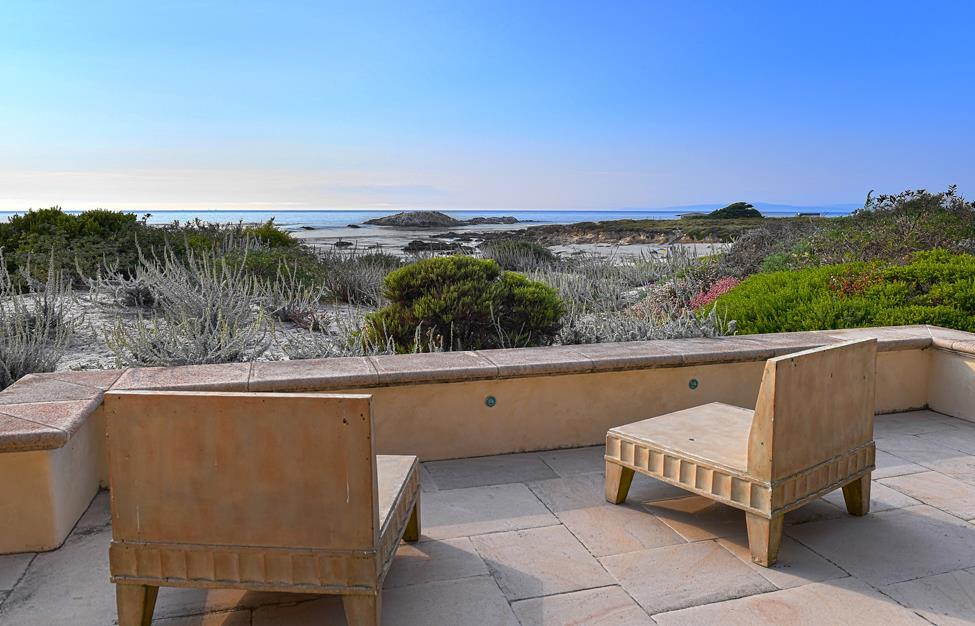 Rising out of the natural dune environment across from some of the longest sandy beaches in Pebble Beach, this French Country home, designed by architect James Newhall Smith, was created to replicate the formality & presence of a Manor House but with the feel, scale and detailing of a cottage. With English Tudor influences inside & outside, the finishes of thick stone floors & rough-hewn wooden beams, combined with fine cabinetry, smooth plaster walls and an abundance of luxury appointments, provide an incredible living environment with ocean and sunset views from nearly every room. Offering rooms for every occasion, there are spacious entertaining areas and intimate living spaces, with patios and terraces on the ocean and dune sides. This exclusive ocean view property features four bedrooms, with a master suite that offers elevator access, along with a library with ocean views. It also provides a separate guest bedroom wing and a large 3-car garage, all set on a private one-acre lot.