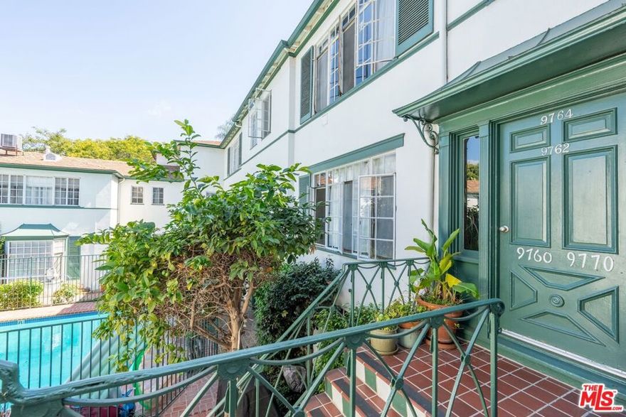 Bright, spacious 2-bedroom, 1-bathroom second floor unit situated in a classic boutique Beverly Hills apartment building.  This charming unit features original hardwood floors, period details and large rooms throughout. The kitchen maintains its original character, while the bathroom has been updated with subway tile, new vanity, and modern fixtures. The charming 1939 building maintains wonderful original detail, both inside and out. Building amenities include a sparkling courtyard pool & community laundry room. Unit comes with private laundry outside of the unit & one covered parking space in carport. Conveniently located next to Roxbury Park, a short distance to Beverly Hills High School and all the best that Beverly Hills has to offer. A turnkey residence and a wonderful place to call home!