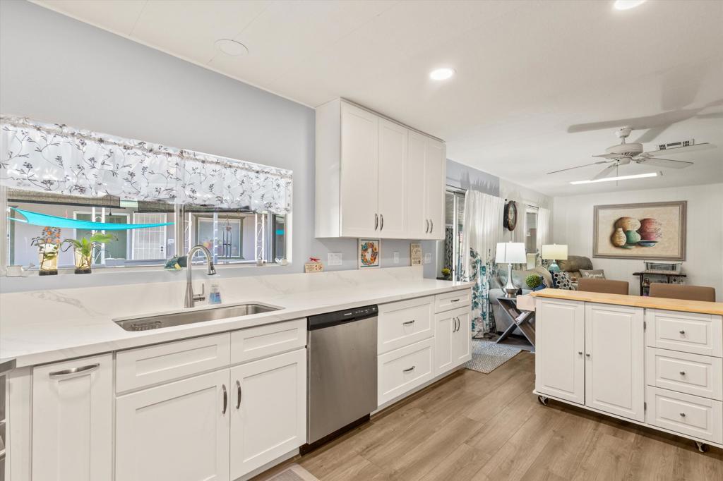 **Motivated Seller** This 2BD/2BA home in Date Palm Country Club is not your average mobile -- it's fresh, open, and sprinkled with 1536 sq ft of beautiful upgrades.Here's what makes it stand out: Complete remodel of kitchen - open layout, stainless steel appliances, and a movable island Tons of counter and cabinet space in kitchen Updated flooring in kitchen and family room Two living spaces - perfect for relaxing + entertaining Remodeled primary bathroom with dual sinks and a modern feel Patio room - a bonus flex space under the carport (not in sq ft) White vinyl fencing - clean look + added privacyAll in the heart of Date Palm CC, a 55+ gated golf community with pickleball, tennis, pools, hot tub, dog park, fitness rooms, a clubhouse, and social events galore.Modern desert living with room to breathe. Come see it.
