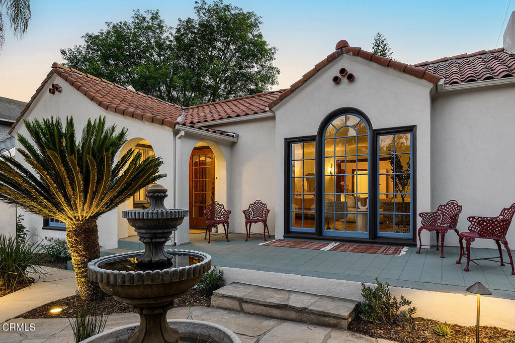 Introducing 5165 La Roda, a meticulous 1924 Spanish home that showcases an era of design and craftsmanship with thoughtful modern upgrades, located in ideal proximity north of Colorado Boulevard in beloved Eagle Rock.This home captures timeless elegance with a welcoming front courtyard with fountain and gardens, leading to the raised front covered entrance. Inside, original wood floors, custom built-ins, mullioned windows, pristine Batchelder fireplace and other period features create warmth and comfort.The front versatile bedroom contains unique built-in secretary with custom trundle bed, creating delightful potential to double as a study, den or guest room. Additional French doors lead to a private side terrace, seamlessly connecting the front and back yards.The gracious formal dining room has original built-in buffet server with leaded glass details and a substantial east window for ample natural light. A swing door leads to the updated, airy kitchen featuring louvered windows, new appliances and new convenient laundry. Additional bedrooms are each well positioned at the rear of the house and offer abundant natural light and charming closet details.Full bathroom has been thoughtfully updated and an all-new convenient powder room offers options for guests.The expansive, flat backyard offers privacy and beauty with surrounding garden and mature trees, with large covered patio perfect for entertaining and grilling.The detached garage is ideally located in rear corner of property and features separate storage/flex space with updated electrical, offering flexibility for a live/work lifestyle. Conveniently located near shops and restaurants in Eagle Rock, Glendale, Highland Park, Pasadena, South Pasadena, Downtown LA, and the iconic Dodger Stadium, this home offers the perfect blend of tranquility and accessibility.