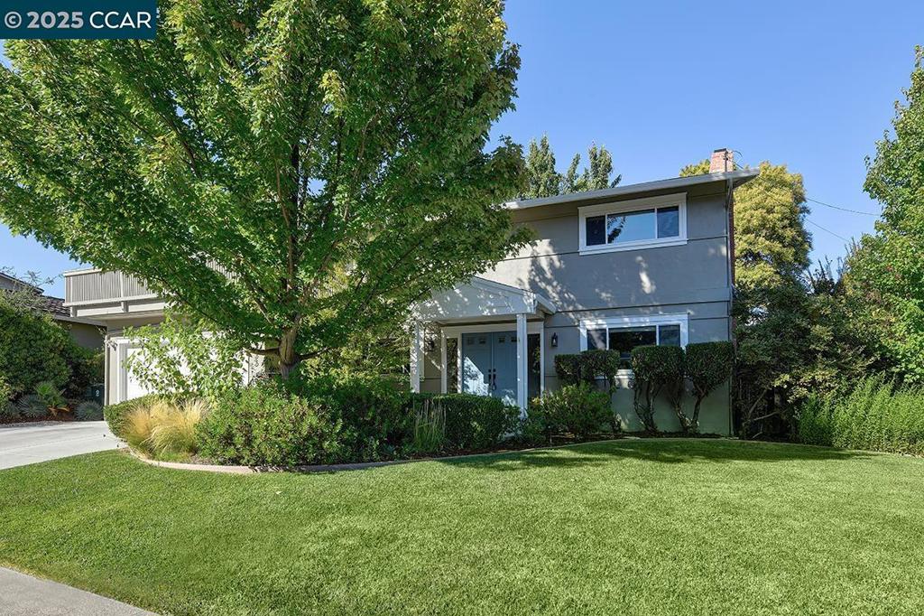 Welcome to this exceptional corner-lot home offering 5BD /2.5 BA, a fully remodeled kitchen/family room, and an expansive, landscaped backyard with garden planters. The open-concept layout includes an inviting living room with fireplace and a flex room that opens to a spacious deck—ideal as an office, gym, or den. Updates include luxury vinyl plank flooring, dual-pane windows, stylish bath upgrades, leased solar, and a refreshed laundry room. A rare blend of comfort, flexibility, and modern convenience awaits!
