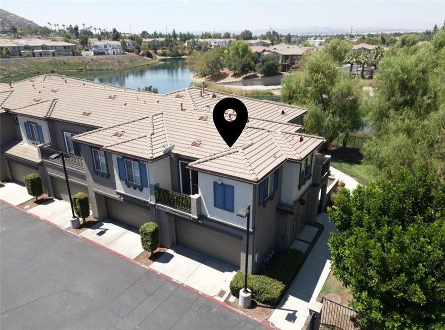 Step into modern excellence with this beautifully upgraded, 1,224 sq ft townhome in the secure, highly sought-after Iris Landing gated community. This bright, 2-story, 2-bedroom, 2-bathroom unit enjoys a prime corner-lot, end-unit location, offering maximum privacy and light.  The home is move-in ready!  With brand-new, high-end features, including sleek LVP flooring installed throughout the main living areas. The gourmet-ready kitchen shines with a gorgeous, upgraded quartz countertop island, perfect for hosting and daily meals.  Relax in the stunning primary suite, a true retreat featuring a completely upgraded master bathroom and a custom-designed, upgraded walk-in closet. Enjoy multiple outdoor spaces with two private balconies and a charming front porch. Convenience is ensured with an inside laundry room and an attached, direct-access two-car garage.  As a resident, you gain unmatched access to the expansive Moreno Valley Ranch HOA amenities, including a 35-acre lake, a large community pool, spa, fitness center, clubhouse, and more!  This home is turnkey!  All the custom work is done. Don't miss this opportunity for a superior lifestyle near shopping and dining!