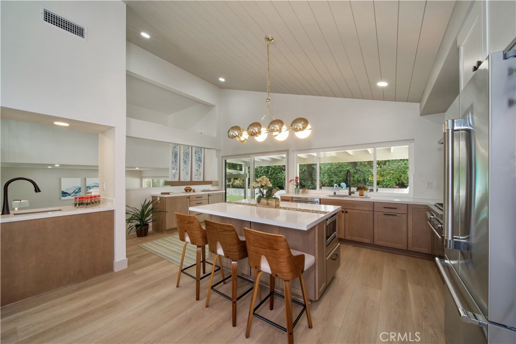 Fully remodeled and permitted home, embracing the mid-century character of its original builder. A licensed contractor performed all work. New electric panel, updated plumbing in kitchen and baths. Three fully rebuilt bathrooms with Restoration Hardware cabinetry, lit vanity mirrors and new hardware and fans. Beautifully expanded chefs kitchen with "Kemper" hardwood cabinets, top of the line Thermador s/s appliances, 6 burner gas range, beverage center and microwave oven in a double sided storage island. Additional storage with built in buffet including pull out drawers and Quartz counter tops throughout. All new flooring was installed throughout the home. The primary bedroom was also reconfigured to create an enviable walk-in closet while also having a second closet for dresses or shoes. The primary bedroom's new built in dresser and sitting alcove create a mid-century retreat feel while still having room for seating or additional bedroom furniture. The staircase was rebuilt and shifted to allow for a grander entrance and ease of flow to the family room. The two restyled fireplaces have become feature walls to both main living spaces. Two hall closets were created further amplifying the robust storage in this large home. New lighting throughout the home provides both style and ambiance for any entertainment or living needs.
Reimagined exterior living brings additional seating in both the front and back yards. A spacious front courtyard was created with new slider access, privacy fencing and creative hardscape. The living room now is lighter and able to offer indoor outdoor living. The uniquely private backyard offers covered brick patios, relandscaped planters with fruit trees, and a new custom built 20 foot bench that separates the creative firepit area from the expansive grass area. There is plenty of room for a pool if desired. Automatic sprinklers were added to the front and back of the home and a drip system in the newly designed planters.
The home was fully tented for termite avoidance and all woodwork has been repaired for years of future enjoyment.
Broker/Agent does not guarantee the accuracy of square footage, bed/bath count, lot size, permit info, descriptions herein. The conditions/features of property provided by seller or obtained from Public Records/other sources. Buyer is advised to independently verify the accuracy of all info through personal inspection and with appropriate professionals.