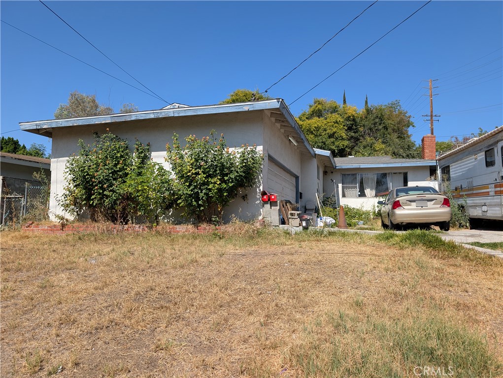 Great Opportunity to Make This La Puente Home Your Own! This 3-bedroom, 2-bathroom home offers a great layout, ready for a new owner with vision and a little TLC. It needs updating, but with some effort and creativity, it can truly shine. The living room features tile flooring and a cozy fireplace, creating a warm and inviting space. The kitchen is equipped with granite countertops, stainless steel appliances, and tile flooring—ready for your personal updates. The primary bedroom includes tile flooring, a ceiling fan, ample closet space, and a private bath with a walk-in shower. The hall bath features a tiled tub/shower combo. Outside, enjoy a spacious patio and block wall fencing for added privacy. The large driveway and 2-car attached garage provide plenty of parking and storage. Located within walking distance to Giano Intermediate School and just minutes from shopping and freeway access. If you're looking for a home you can personalize and make truly yours, this is your chance. Bring your ideas and get started today!