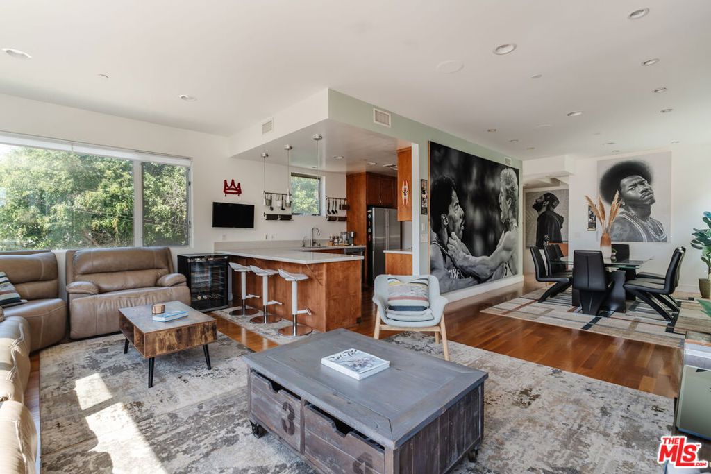 Architectural, single family home with expansive rooftop deck overlooking the historic Venice Canals. This south facing, sun-drenched home with no shared walls is set back off the street, offering a peaceful sanctuary despite it's central location close to the beach, the canals and all that Abbot Kinney has to offer. The expansive first floor offers an open floor plan with two seating areas, a gas fireplace, a spacious dining area and a well-appointed kitchen with breakfast bar - the perfect place to enjoy your bounty from the Venice Farmer's Market which is right across the street. Upstairs are two bedrooms, two bathrooms, a bonus loft space perfect for a home office, gym or lounge area, and a laundry room. The spacious primary suite features a large walk-in closet, and a primary bath with dual sinks, soaking tub and a separate shower. You'll love the high ceilings, abundant natural light, and modern but warm finishes throughout the interior, but the rooftop deck is the ultimate cherry on top! With views of the canal & the mountains, a built in outdoor kitchen & BBQ, and ample room to entertain, this is where you'll take full advantage of our coveted SoCal climate. Additional features include direct access 2 car garage, EV charging, and secured entry.