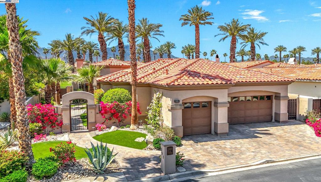 GOLF COURSE LIVING AT ITS' FINEST! Nestled in the heart of Indian Ridge Country Club, this desert home is on the club's signature golf hole. Enjoy the quiet neighborhood and stunning colorful views The Santa Rosa and San Jacinto Mountain sunsets. An Outdoor Oasis: Capturing the custom designed fire-pit area, rejuvenating saltwater spa with high intensity jets, and barbecue area, your patio is set to stage many memorable gatherings of family and friends for years to come. Exceptional Indoor Living: Expansive glass doors open seamlessly to blend luxury with nature, accentuating the 12-foot ceilings. Warm modern living spaces have been professionally designed by Newport Beach Restoration Hardware. Chef-Inspired Kitchen: Cook like a chef with state-of-the-art appliances, custom cabinetry, and generous kitchen pantry. Enjoy the formal dining area that invites intimate gatherings or family celebrations. Three Ensuite Bedrooms: Offer separate living quarters to enjoy privacy and rest. Primary and powder baths feature Toto washlets. For your year-round environmental comfort, the home boasts: • A 42-panel solar system (Owned) • Three new, large capacity air conditioners • Whole home air purifier GOLF MEMBERSHIP AVAILABLE - no wait. Plus Tennis, Pickle Ball, Bocce, Fitness Center