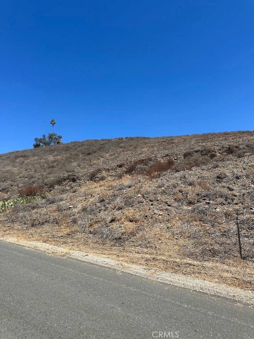 Prime opportunity in Menifee, one of the fastest-growing cities in Riverside County! This 1.34-acre parcel is positioned near the corner of Beverly Dr and Juanita Dr. The lot faces south with views of nearby mountains, foothills, and neighboring communities from the street level. The lot's gentle upslope offers the potential to create a homesite pad higher on the property- ideal for preserving privacy and maximizing the tranquil views. Conveniently situated on the Beverly Dr. paved road with water and power available nearby making this lot ideal for custom build or a long-term investment.



Buyer to verify all zoning, utilities, setbacks, and development potential with the City of Menifee and County of Riverside.