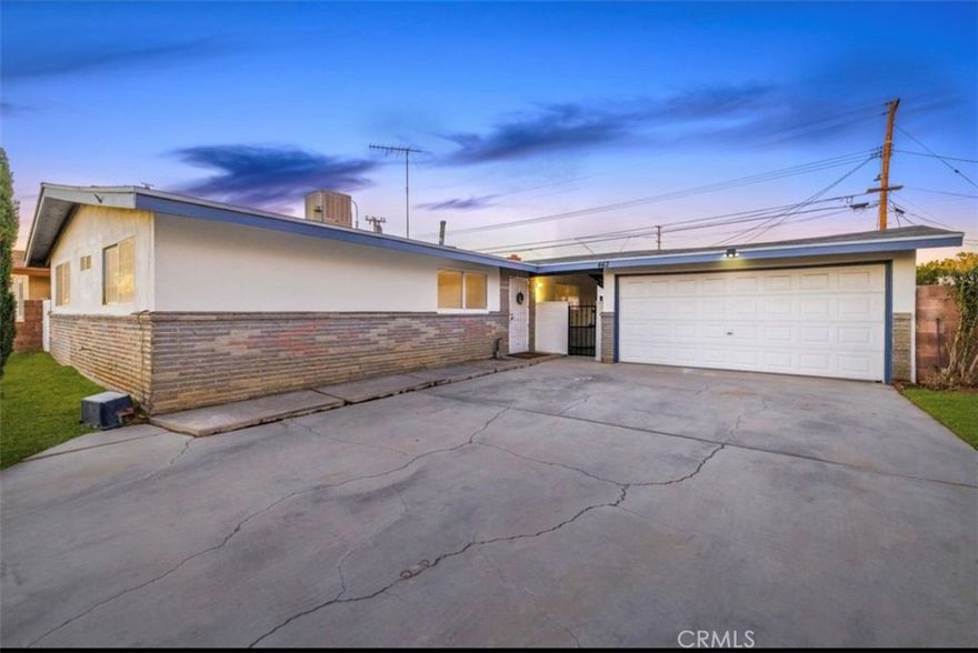 Lancaster home, well-maintained 4BD/2BA Lancaster home ~1,600 sq. ft. Tile flooring throughout, spacious bedrooms, and updated bathrooms. Large open kitchen with new quartz countertops. Generous family room features a striking rock fireplace and sliding glass door to a sizable backyard and breezeway to a detached garage. Inside laundry for added convenience. Prime location near schools, shopping and freeway access — ideal for commuters.