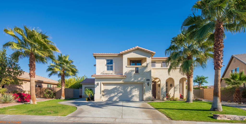 Spacious 2-story: 1st floor has 1 bedroom, 1 bathroom, gourmet kitchen, informal living area, and formal living area with a cozy fireplace. 2nd floor has 4 bedrooms 2 bathrooms, included is Master suite with walk-in closet, soaking tub & dual sinks. Laundry room is also located upstairs. Entertainer's backyard with palapa, outdoor BBQ, and wiring for speakers and TV. Spacious 3-car garage. Home sits across from park, low HOA!
