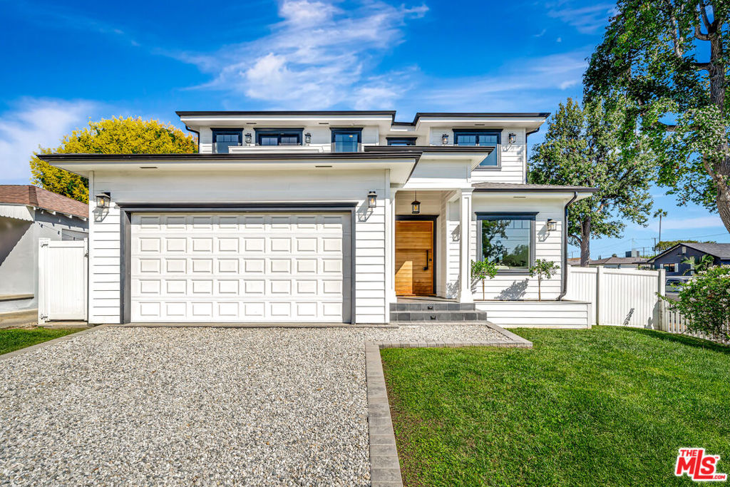 Experience the perfect blend of modern luxury and comfortable living in this stunning two-story home. Step inside to discover open, sun-filled spaces with elegant wood flooring, high-end finishes, and thoughtful details throughout. The gourmet kitchen boasts sleek cabinetry, a large island with seating, stainless steel appliances, and a cozy dining area ideal for family meals and entertaining friends. Retreat to the spacious living room, where natural light pours in through multiple windows, offering relaxing views of the neighborhood and seamless access to the outdoors. Upstairs, unwind in the serene primary suite with a designer en suite bathroom featuring a contemporary soaking tub, double vanity, walk-in shower, and ample storage. Luxurious closet space awaits to keep everything organized with built-in shelving and drawers. Step outside to your private oasis a sparkling pool and spa set amidst manicured turf and a large private white-fenced yard. Perfect for lounging, entertaining, or family fun, with a beautiful balcony providing poolside and tree-filled views. The home's inviting curb appeal is matched by its versatile garage and welcoming entrance. This meticulously maintained residence combines sophistication and warmth, offering the ideal backdrop for memorable moments and everyday comfort. Welcome home to a space where every detail is designed for living beautifully.