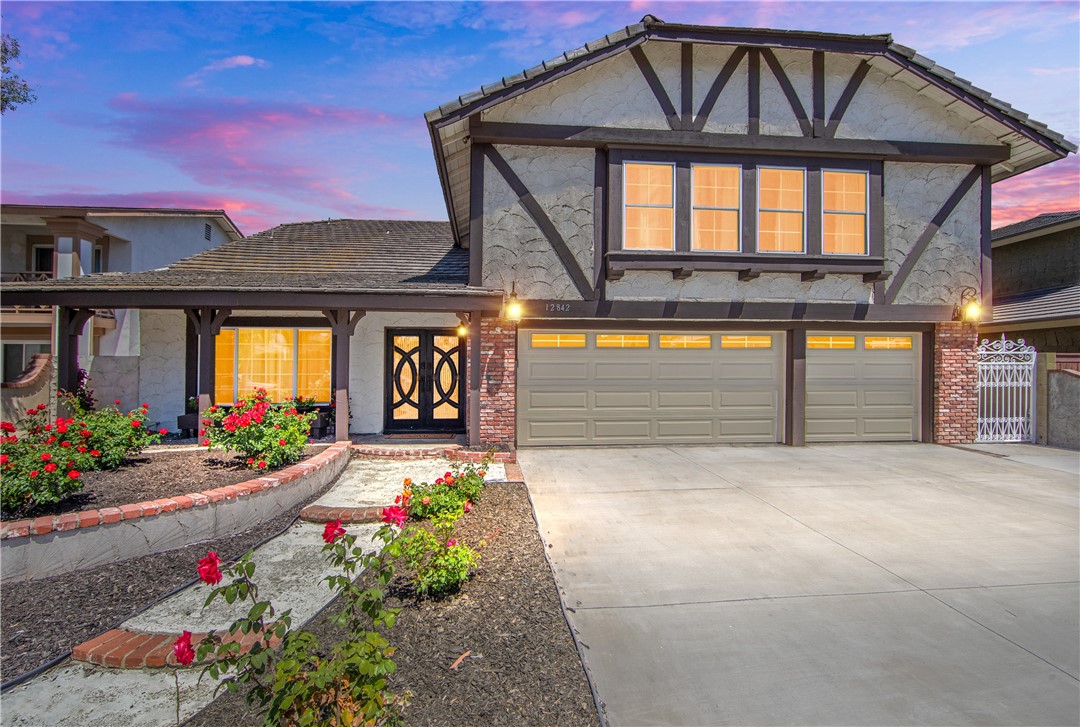 Rarely on the market... This Charleston floorplan is the largest within the small 92 home neighborhood of Valley View Estates, in the cherished community of West Garden Grove. A double door leads to the formal dining room with high ceilings and adjacent dining room. Woodlike tile flooring flows through the downstairs and leads to the gorgeously remodeled oversized kitchen with an abundance of cabinets, sparkling quartz countertops and stainless steel appliances. This home is perfect for entertaining and hosting friends and family in the two separate living rooms and the overside backyard featuring a large pool and spa. The downstairs full bathroom is near the indoor laundry and down the hall from the 3 car garage. Luxury vinyl flooring flows up the stairs and leads to the 4 bedrooms, including 2 primary bedrooms with ensuite bathrooms and walk in closets. Boasting almost 3,000 square feet this home is one of a kind and move in ready. Built almost 20 years after the rest of West Grove, this small enclave of homes boasts underground utilities and wide streets. This is the best of the best West Grove and attends top rated GGUSD Schools, Barker Elementary, Bell Intermediate and Pacifica High School. Close to shopping, the 405 and 22 freeways. With location, spaciousness and remodeling, this home is a must see!