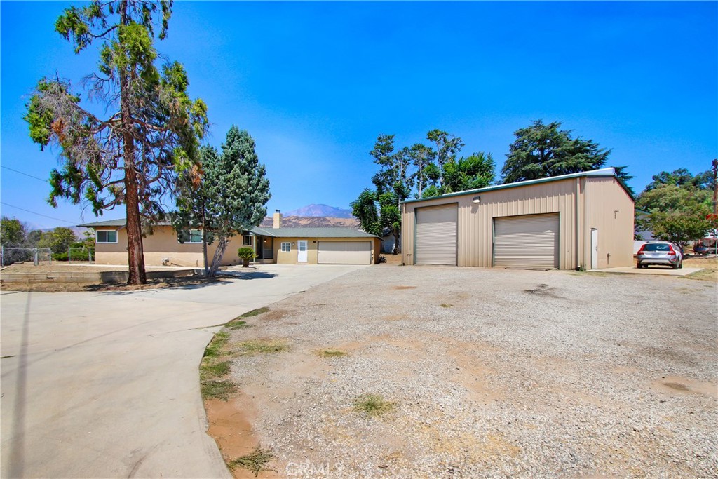 Looking for land? How about a HUGE shop? This Wildwood Canyon property is unique: Great Location, 1.25 ACRES of land, views, room for all your toys. There is a private electric gate when entering the driveway, the property is very private, with a long driveway to the house and shop. The Beautiful 3-bedroom 2-bathroom Single Story home also has a huge office/bonus room/den space. There is also a 2-car attached garage with a large office space that has a separate entry and a 1/2 bath. The property has gorgeous mountain views, and an abundance of land. If you are looking for a shop, this one is impressive! The shop is over 1,400 square feet with two roll up garage doors, one is 16 feet high, and the other is 10 feet high. Both the house remodel as well as the shop were done respecting quality workmanship. Previous Seller was thinking of sub dividing the property and started the process, which has since expired; however, there was a house that was removed that used to sit near the street. All utilities are still in place from the original house. This property is on City Sewer, Not Septic.
This property does not have a Homeowners association and does not have Mello Roos taxes.