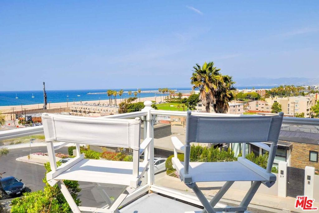 Ocean views from all 3 bedrooms, main living room and huge outdoor deck, complete with hot tub and gigantic Restoration Hardware couch. Views, views views Charming Cape Cod home, nestled on the Playa Del Rey bluffs with panoramic views, ocean, whitewater, mountains and city lights. 5 minute walk to the beach; 2 minutes walk to restaurants and Ballona Lagoon Park. 3 bd, 3 bath, large gourmet kitchen, great tv room. One of the most exclusive streets in all of Playa del Rey. This home is uniquely positioned below the top of the hill, naturally shielding it from flight noise and making it one of the quietest locations in the area!
