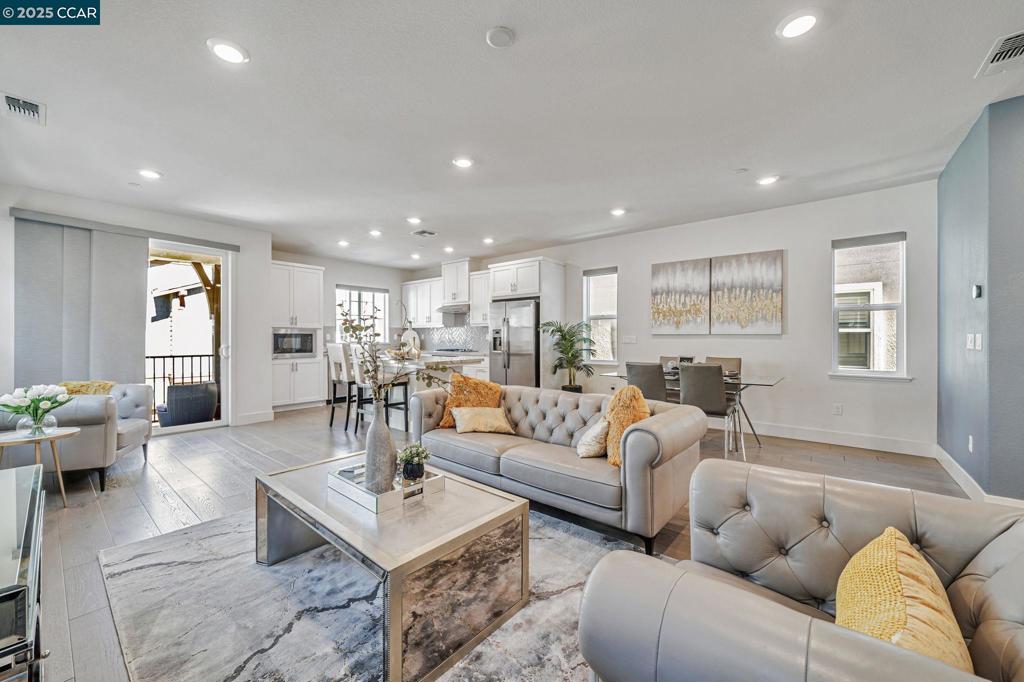 Experience elevated living in this beautifully upgraded 4-bedroom+office, 4-bath detached home in San Ramon’s sought-after Preserve community. This premium lot offers no rear neighbor and stunning hilltop views. The open-concept layout features 9-ft ceilings, abundant light, and smart upgrades—owned solar, Tesla charger, triple-zone climate & more! The sleek kitchen flows into spacious living and dining areas—perfect for entertaining. A main-level guest suite with private bath, walk-in closet & backyard access adds flexibility for guests or extended family. Upstairs a bedroom & bathrooms on each floor, making it super convenient. Three walk-in closets providing sufficient storage space. A backyard with beautiful views of the hills with fruit trees. Enjoy a resort-style lifestyle with HOA amenities, including a pool, an open lounge with a cozy fireplace, a BBQ area & a bocce court. Plus, city facilities such as football & baseball ct, a dog park, playground. Super close to day cares, top rated schools, gym, pet care, kids after school activities like swimming, gymnastics, grocery stores, costco, restaurants & Fwy 680. This home offers location, lifestyle & unbeatable Value- All in One!!