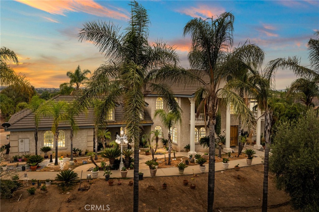 Welcome to the Luxury Hillcrest Estates Community! This is a custom built 2 story, 4 bedroom,3 bath with 2 1/2 baths. This home has a beautiful entranceway. There is one bedroom with full bath downstairs. You have a formal diningroom, formal livingroom, family room with wet bar and guest bath room. The upstairs includes a large loft with wet bar, balcony and guest bathroom. 2 of the bedrooms share a Jack and Jill bathroom and both have balcony access. Large master bedroom with balcony access to both front of house and back of house. 3 car garage and car port with also a large driveway with plenty or parking. The back yard is well kept up with a nice Koi pond, fruit trees, vegetable garden. Private Security Gate. Quit community close to shopping. This is a must come see property.