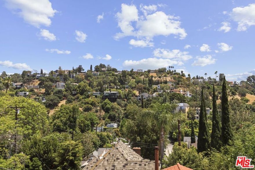 This property blends luxurious living with a rich musical history, offering a unique opportunity for anyone passionate about music or seeking a gorgeous home in the East Hollywood Hills. Historic Mothership Studio: Record your music in a space used by legends like Van Halen and Ozzy. Stunning Views: Enjoy panoramic city and canyon views from the main living area and primary suite. Modern Renovations: Updated with a contemporary touch while maintaining classic elegance. Open Floor Plan: Chef's kitchen (Viking Appliances) with stainless appliances and oversized island, wine refrigerator, perfect for entertaining. Private Master Suite: Expansive views, a fireplace, and a luxurious master bath with a soaker tub and dual walk-in closet. Outdoor Spaces: Includes a courtyard, terraced decks, and gardens ideal for gatherings. Separate backyard building ideal for home office/gym. Dedicated Sound Studio with separate entrance or access to the home:1400 sq ft (approx) with live room, mic room, and lounge area dedicated bedroom and bathroom, perfect for music creation or potential podcast taping. Convenient Parking: A 3-car garage. This home perfectly encapsulates the Southern California lifestyle with seamless indoor/outdoor living. It's truly a rare find!  CONTACT LISTING AGENT FOR POTENTIAL LEASE TOO.