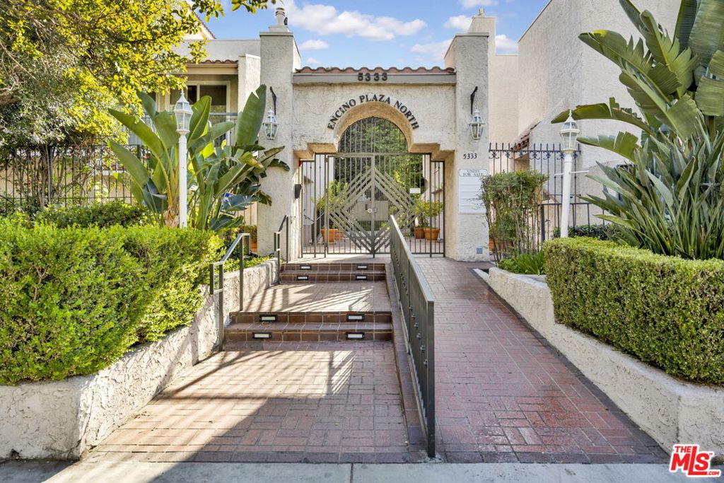 This expansive 2-bedroom, 2-bathroom residence offers over 2,100 square feet of interior space, thoughtfully laid out for both everyday living and entertaining. Situated in one of Encino's most desirable communities, this condo provides ideal living. Inside, a grand formal living room welcomes you with rich wood flooring, recessed lighting, and a corner fireplace. The adjoining bonus room offers flexible use as a home office, creative space, or second lounge. The spacious kitchen and dining area enjoy abundant natural light, with plenty of room to reimagine and customize to your taste. The oversized primary suite features its own fireplace, generous closet space, and an en-suite bath with dual vanities, soaking tub, and shower. While the layout and bones are exceptional, the home offers a unique opportunity to update finishes and add value over time. Additional highlights include in-unit laundry, a private balcony, side-by-side parking, and a dedicated storage unit. Community amenities include two pools, two spas, fitness center, clubhouse, and gated access. HOA covers EQ insurance, water, trash, sewer, upgraded cable and internet, and more. All just moments from Ventura Blvd's best restaurants, shopping, and easy freeway access.