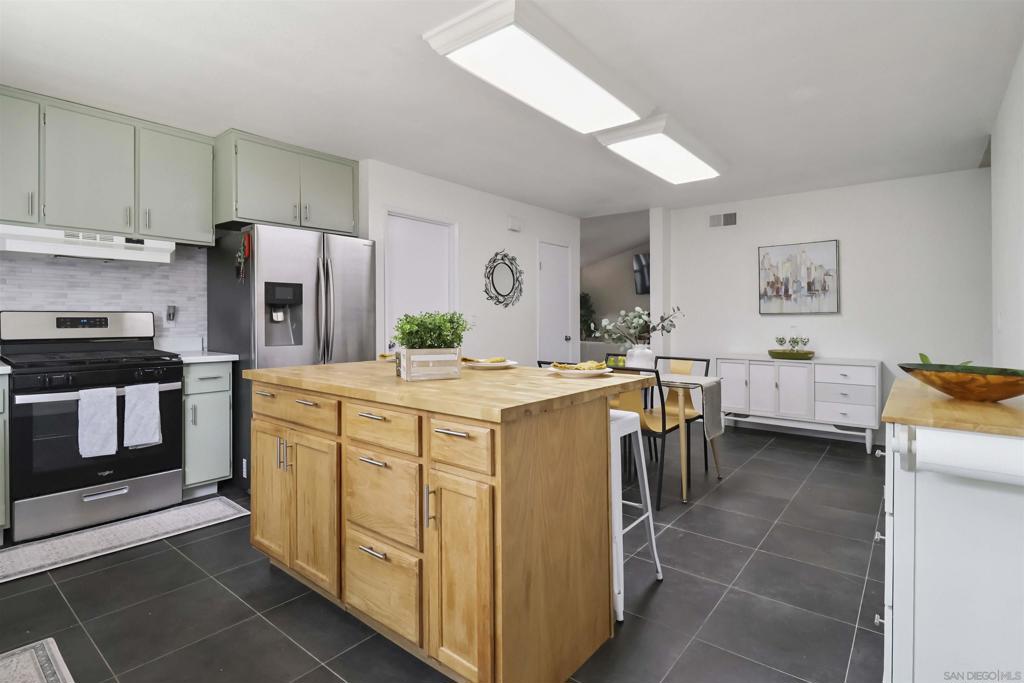 From the moment you walk in, this 4-bedroom, 2-bath home just feels right. Natural light floods the vaulted living room complete with a brick fireplace. This flows into an open kitchen with a center island, stainless appliances, and a smart cooking triangle. The spacious primary suite overlooks the backyard with space to relax. Enjoy two patios, a fully fenced yard, and PAID SOLAR so you can run the A/C all summer long. Big-ticket updates—roof, HVAC, windows, and 19 solar panels—are already done! Tucked into a welcoming neighborhood that borders Santee/Lakeside, close to parks, shopping, and freeways. Appliances stay (stainless steel frig, smart washer/dryer); NO HOA fees! Welcome to a home that offers more than just space—it offers comfort, smart upgrades, and flexibility for whatever season of life you’re in. Step inside and you’ll notice the natural light pouring through vaulted ceilings and into an open layout that feels just right. The living room features a brick fireplace and plush carpet underfoot, creating a cozy space to unwind. The kitchen is generous and functional, with a large center island, stainless steel appliances, and an efficient layout perfect for everyday meals or entertaining. With four true bedrooms and two updated bathrooms, there’s room to grow, host, or simply enjoy a bit more breathing space. The primary suite feels like a retreat with backyard views and plenty of room for your favorite furnishings—whether that’s a reading nook, a workspace, or a yoga mat. Major upgrades have already been handled, giving you peace of mind from day one. You’ll benefit from a newer roof, dual pane windows, a modern HVAC system, and fully paid solar—so yes, you can run the A/C daily without the fear of an outrageous spike in your utility bill. Outside, the fully fenced backyard is a blank canvas—offering the potential for a garden, pool, play area, or anything else you dream up. The extended side yard adds versatility, whether for an outdoor kitchen, for pets, storage, or future expansion. Conveniently located off El Nopal—one of Lakeside’s main thoroughfares—you’ll have easy access to shopping, dining, parks, and major roads including Los Ranchitos, Mast Blvd, and Magnolia. During the holidays, you're just a quick drive from Starlight Circle, one of East County’s most iconic and festive traditions. Whether you’re upsizing, rightsizing, or buying your first home, this property offers a great foundation, thoughtful improvements, and plenty of potential to make it your own.