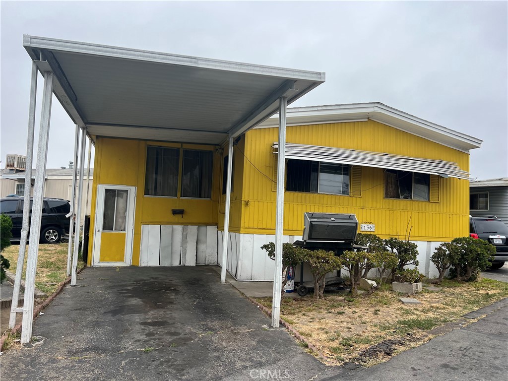 Welcome to Country Estate Mobile Home Park! A family-park setting with a community pool and recreation area. This home is nicely located in the front just as you enter the park, corner lot with 1 front parking and 1 assigned parking space. Charming manufactured that features 3 bedrooms; 2 bathrooms; covered patio for extra room or office, laminate flooring all throughout. The master bedroom includes its own bathroom and a walk-in closet. While the home needs some TLC, it has great potential - perfect for a buyer with a vision or an investor looking for a solid opportunity. With the right upgrades, this home could truly shine.
