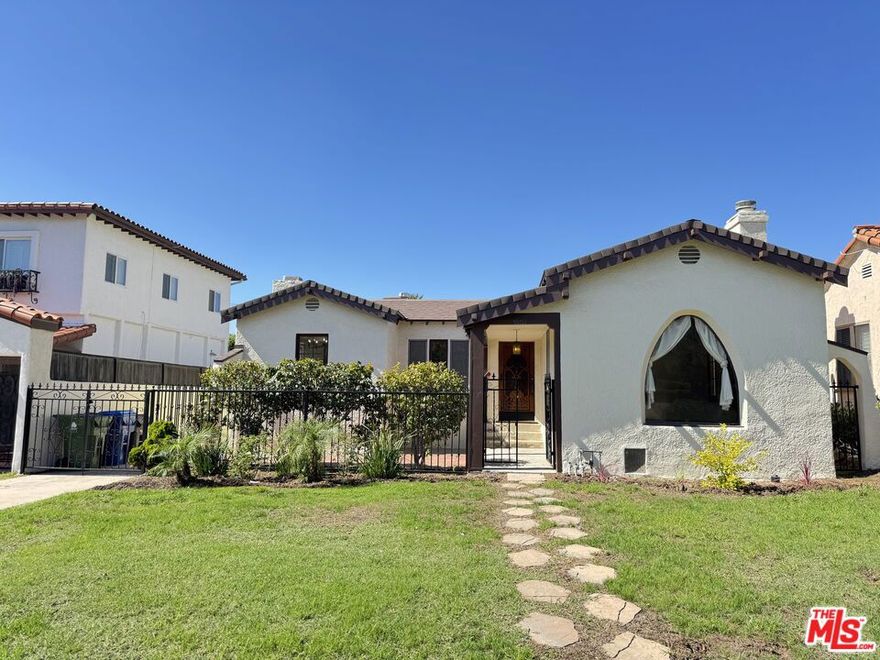 A charming Spanish Colonial home in the highly desirable neighborhood of Cheviot Hills, this lovely home features gorgeous wood flooring and custom wood doors throughout. Beautiful beamed ceilings in the living room, plus a decorative fireplace with stone hearth and tile accents, and a picture window overlooking the grassy front yard. The upgraded kitchen has brand new white Quartz countertops, an eat-in dining area, custom paint, ample cabinets, and newer dishwasher, gas range, and refrigerator. A pass through from the kitchen leads to the laundry room, with access to a Jack-and-Jill 3/4 bath on one side, plus access to the back door. The bedrooms and closets are generous for this era of home, with multiple windows in each room. The rear bedrooms overlook the expansive backyard, with Jack-and-Jill access to the 3/4 bathroom in the left-side bedroom. A full size bath in the hallway serves the other two bedrooms, including a tub enclosure with shower, a pedestal sink, and a convenient storage cabinet tucked under the window. The hallway has stunning large custom built-in closet with beautiful wood-inlay on the doors, matching the bedroom doors and smaller hallway linen-closet doors. Stepping outside, the private backyard and large concrete patio are perfect for entertaining. The yard has been recently re-seeded, and the gardener is paid by the owner. The garage can used for storage or parking for a smaller vehicle, and includes a separate step-down storage area at the rear, including a side-door for easy access. Additional parking is available on the gated driveway. The home is an easy walk to Palms Park and the Palms Park Recreation Center, as well as Cheviot Hills Recreation area, Hillcrest Country Club, Rancho 3 Par Golf Course, and to shops and restaurants. Owner will consider pets under 30 lbs, with additional deposit and some restrictions. Tenant pays all utilities.