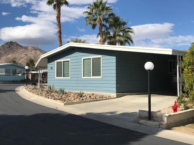 This is a Must See!!! Beautifully remodeled, totally Turnkey, fully furnished home in Indian Springs Mobile Home Park! This has a great view from the patio with misters. This immaculate home looks like it was designed & furnished by a professional decorator, come see and you'll agree - it's a showstopper! Stunning designer furnishings throughout the home include a 6-seat dining table & chairs, sofa and accent chair, coffee table, carpets, 2 bedrooms sets w/ bedding, 4 barstools & more!! Eye catching, graphic wall paper on select accent walls throughout the home add to the artistic look. Fully Remodeled within the past two years!!! Move in ready- Dishes, cookware, glassware, silverware, bedding...This home has it all right here for you- just bring your clothes!!!! Close to The El Paseo Shopping & Dining Corridor and across from the Living Desert. Magnificent scenery and views of close-up mountains, stunning sunrises, and breathtaking sunsets. Fabulous club house with heated pool, and large spa. Rent controlled park with low land fee of $712.97monthly. Privately owned park. Rent controlled, leased land. Not Indian Land. Subletting allowed after 1 year of residency.
