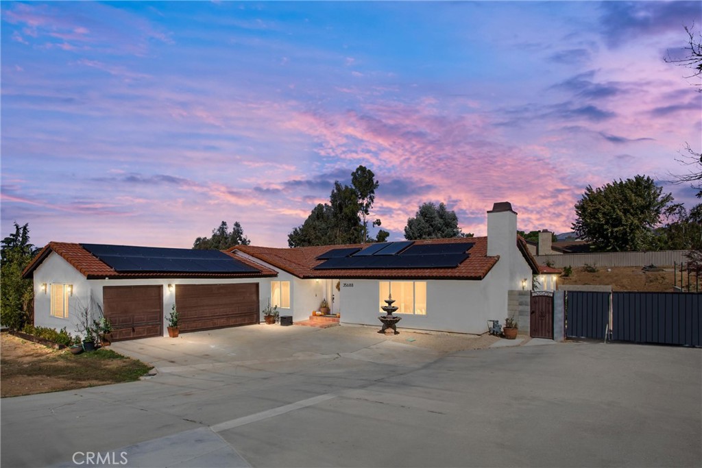 Welcome to 35688 Date Ave., Upper Yucaipa, a rare opportunity featuring two single-family homes on a spacious 0.51 Acre Corner Lot. Perfect for multi-generational living, rental income, or investment. The main home offers 4 spacious bedrooms, 2.5 baths, and approximately 1,942 of comfortable living space. It features a traditional layout with a spacious living room, dining area, and generous sized bedrooms. The remodeled kitchen includes granite countertops, pantry, stainless steal appliances, recessed lighting, and breakfast bar. Additional highlights include dual-pane windows, Central A/C and heating, and primary suite with french doors leading to backyard. The second home, newly built in 2023, offers 3 bedrooms, 2 bathroom an open concept design, and modern finishes, ideal for extended family or additional rental income. enjoy ample RV parking and access, a large covered patio perfect for entertaining, over 40 fruit trees, and beautiful mountain views. With 26 Paid Solar Panels, this property provides energy efficiency and long term savings. Located just minutes from Oak Glen's apple Orchard, hiking trails, schools, and shopping, this property combines comfort, flexibility, and touch of country charm. Two Homes, RV Parking, and over 40 fruit trees, Your Yucaipa Oasis Awaits!