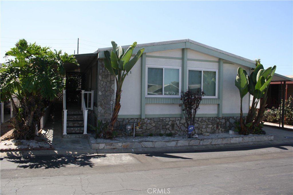 This is a nicely maintained and updated, large 2-bedroom, 2-bathroom home that is in very good shape located in the wonderful Resort Style 5-Star Colony Cove Manufactured Housing Community. The Space Rent is only $750/ month and under strict RENT CONTROL and is one of the lowest space rents in the entire South Bay. There is a nice, long covered porch at the main entrance side to the home. Additionally, there is a nice concrete patio with areas for a garden & plants and a large shed. It features a large Living Room, Dining Room area as well as additional sitting area off the kitchen. It has a Large Master with a private bathroom, shower and separate large walk-in bathtub and new double pane windows throughout the home. The home is located on a large lot with ample space around the home. The rear of the home has space for a garden. The home has a long, covered carport for two cars as well as a large storage shed. The Kitchen is in good shape with newer appliances and a breakfast area. The washer & dryer are in a designated area by the carport door entry. All kitchen appliances come with the home. The park has a very large club house with a beautiful swimming pool, billiards room, exercise room and gathering areas.