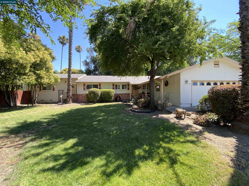 New Photos will be Available 8/2/25 Welcome to this spacious single-level home, tucked at the end of a quiet cul-de-sac in Concord’s sought-after Four Corners–Ygnacio Valley neighborhood. This charming residence offers: 4 bedrooms and 3 full baths, including a spacious in-law/ADU suite with a private entrance—ideal for multigenerational living, generating passive income, hosting guests or serving as a primary retreat. Expansive rear grounds that create a true outdoor oasis—perfect for hosting special occasions or simply unwinding in peace. A thoughtfully designed indoor-outdoor flow that makes this home a serene sanctuary built for creating lasting memories. An open-concept floorplan featuring a cozy brick fireplace and a mix of hardwood, tile, and carpet flooring. Attached two-car garage plus extended driveway space—perfect for RV or boat parking. The kitchen features tile countertops and built-in cabinetry. This home blends comfort, flexibility, and opportunity. It's perfect for buyers seeking a livable space with solid bones and great potential. With a bit of renovation, you can turn your vision into reality and transform it into your dream home. All this, minutes from Walnut Creek, top-rated schools, parks, and shopping centers. Schedule your private tour today!