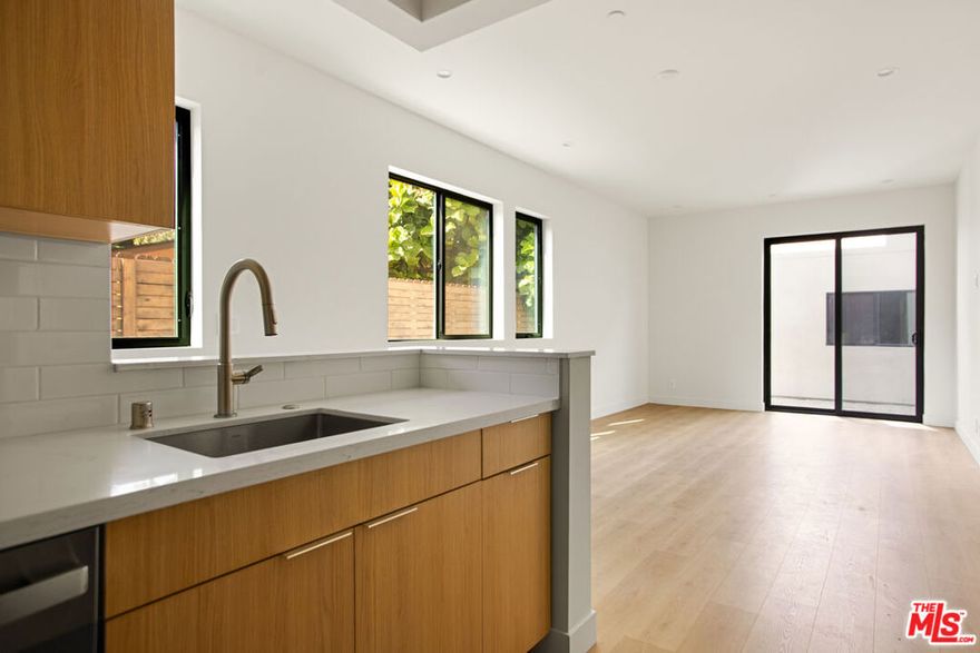 ** PET FRIENDLY ** WASHER/DRYER ** CENTRAL A/C ** MODERN CONSTRUCTION ** HIGH CEILINGS ** BALCONIES ** Welcome to your stylish hillside escape in the heart of Silver Lake! This stunning pet-friendly upper-level 2-bedroom, 2-bath home offers 752 sq ft of sun-drenched living space designed with comfort and sophistication in mind. Step inside to discover an open-concept layout with oversized windows, sleek flooring, and thoughtful designer finishes that create a perfect blend of warmth and modern appeal. The updated kitchen comes fully equipped with an electric range, refrigerator, dishwasher, washer, and dryer, everything you need for easy everyday living. Both bedrooms are generously sized with beautiful natural light, while the bathrooms boast contemporary tile work and chic fixtures. Step out onto your private balcony for your morning coffee, or head upstairs to your expansive private rooftop deck entertainer's dream with sweeping hillside views and plenty of room to unwind under the California sun. Located on a quiet, charming street, yet just minutes from the best of Silver Lake, Echo Park, and Atwater Village, you'll have easy access to iconic coffee shops, hip eateries, trendy boutiques, and the Silver Lake Reservoir for weekend walks. Enjoy the perfect balance of city energy and neighborhood. This pet-friendly gem is modern Los Angeles living at its best, waiting for you at 2671  Benedict Street. Pictures may be a mix of similar units.