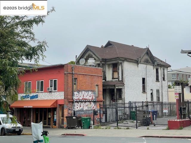 Front Building is tenant occupied by ground level restaurant and 2 BR apartment above. Rear house is vacant and dangerous to enter. Addresses are 2503, 2505, 2507, 2509 Dwight Way, Berkeley. It is possible to build a 7 story mixed use building on the site.