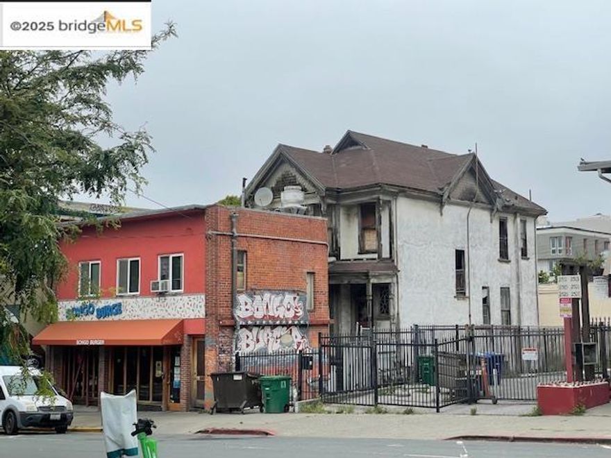 Front Building is tenant occupied by ground level restaurant and 2 BR apartment above.  Rear house is vacant and dangerous to enter.  Addresses are 2503, 2505, 2507, 2509 Dwight Way, Berkeley.  It is possible to build a 7 story mixed use building on the site.